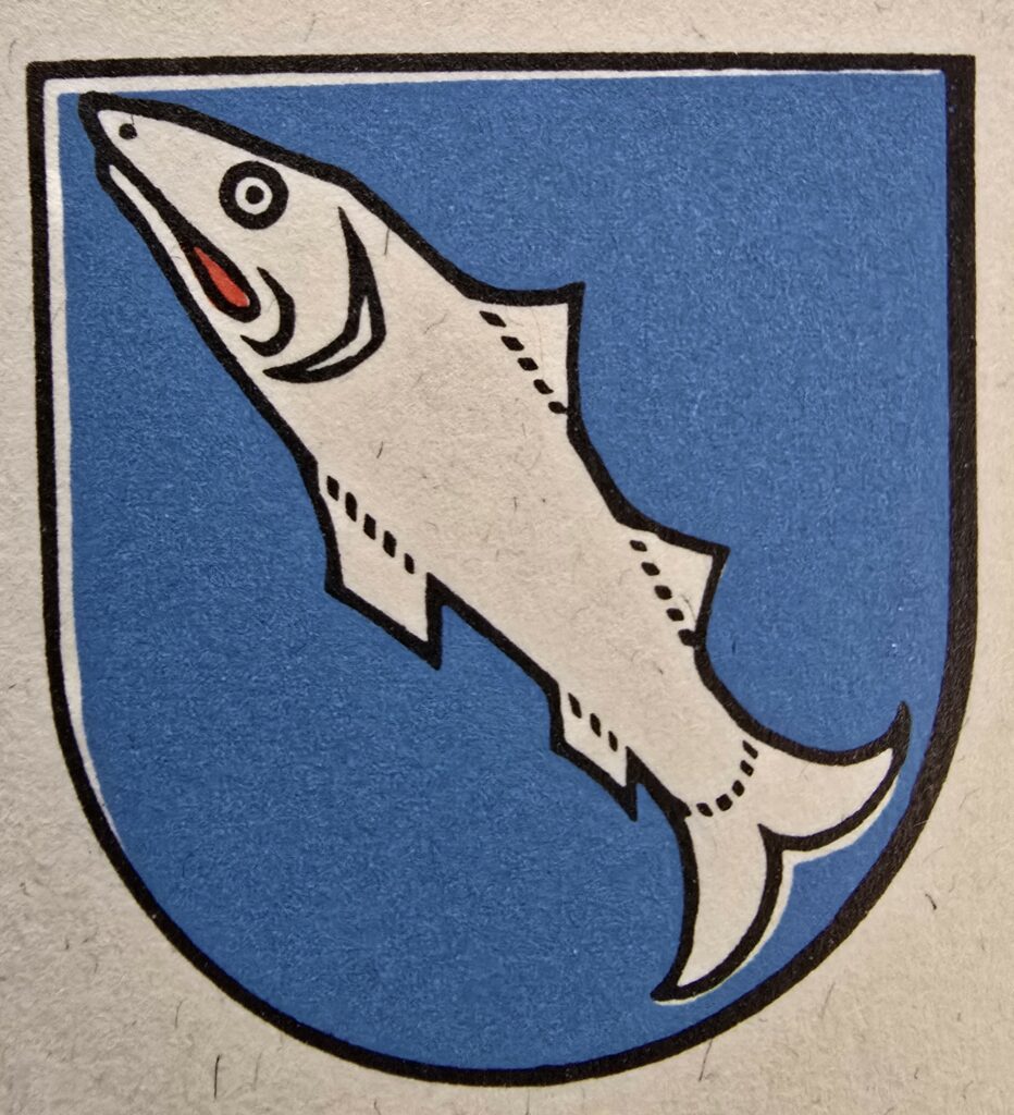 Gl'emblem vegl da Laax, cul pèsch che fa ina tschera brutta.