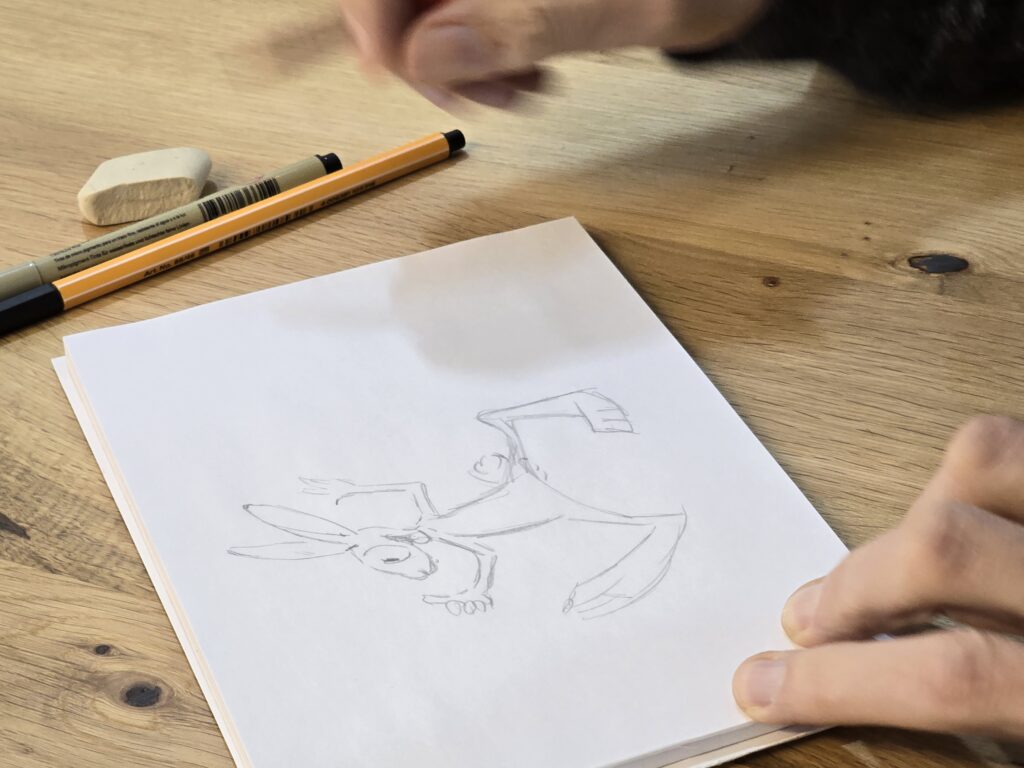 Il dissegn cun rispli è pront. Ussa cumenza il caricaturist ad ir cun il fieuter.